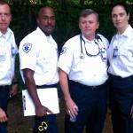 The EMTs on the set of Army Wives epsiode 620 "The War at Home". EMT One is Mike Robinson (second from left) and EMT Two is Jennifer Christa Palmer (far right). 